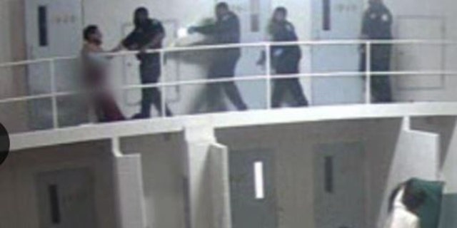 The Clayton County Medical Examiner's office said Terry Lee Thurmond may have been tased at this point. Thurmond appears to begin hanging over the 2nd floor railing.