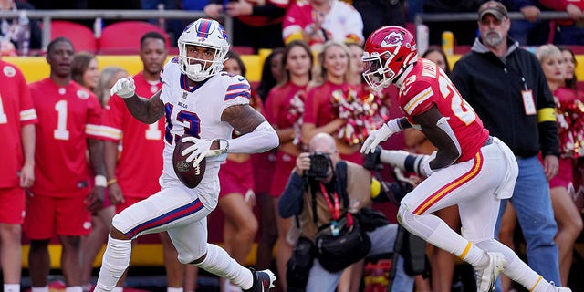 Gabe Davis (13) of the Buffalo Bills catches a touchdown pass during the second quarter against the Kansas City Chiefs at Arrowhead Stadium on October 16, 2022 in Kansas City, Missouri. 