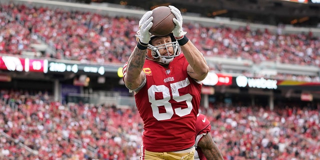 San Francisco 49ers tight end George Kittle (85) catches a touchdown against the Arizona Cardinals during the first half of an NFL football game in Santa Clara, Calif., Sunday, Jan. 8, 2023.