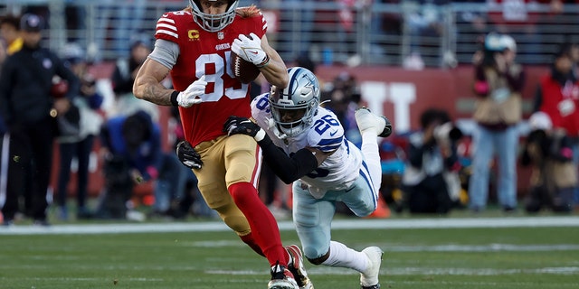 San Francisco 49ers tight end George Cattle (85) runs against Dallas Cowboys cornerback Daron Bland (26) during the first half of an NFL Divisional Round Playoff football game on Sunday, Jan. 22, 2023, in Santa Clara, California.