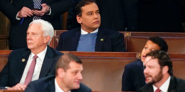 Rep. George Santos, R-N.Y., top center, sits in the House chamber on the opening day of the 118th Congress at the U.S. Capitol. Santos has co-sponsored a bill to make the AR-15 the National Gun of the United States.