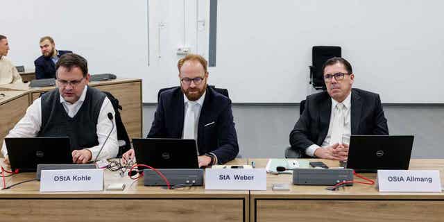 State prosecutors take their seats at the Higher Regional Court in Dresden, Germany, on Jan. 10, 2023, prior to a hearing in the trial over a jewelry heist on the Green Vault museum in Dresden's Royal Palace in November 2019. Four of the defendants in the trial have accepted deals which will reduce their punishment in exchange for confessions and the return of some of the haul.