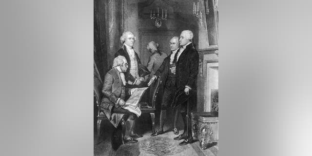 President George Washington's first cabinet, circa 1790. Left to right: Secretary of War Henry Knox (1750-1806), Secretary of State Thomas Jefferson (1743-1826), Attorney General Edmund Randolph (1753-1813, back turned), Treasury Secretary Alexander Hamilton (175 -1804) and George Washington (1732-1799).