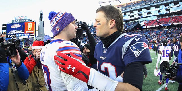 Josh Allen #17 of the Buffalo Bills and Tom Brady #12 of the New England Patriots stand on the field after the New England Patriots defeated the Buffalo Bills 24-12 at Gillette Stadium on December 23, 2018 in Foxborough , Mass. 