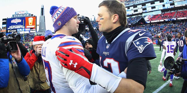 No. 17 Josh Allen of the Buffalo Bills and No. 12 Tom Brady of the New England Patriots meet on the field after the New England Patriots defeated the Buffalo Bills 24–12 at Gillette Stadium on December 23, 2018 years in Foxborough, Massachusetts.