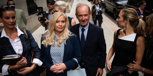 David Boies, representing several of Jeffrey Epstein's alleged victims, center, arrives with Annie Farmer, second right, and Virginia Giuffre, alleged victims of Jeffrey Epstein, second left, at federal court in New York, U.S., on Tuesday, Aug. 27, 2019. 