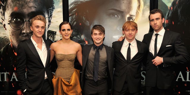 Rupert Grint, second from right, spoke about he and his co-stars Daniel Radcliffe, center, and Emma Watson's unique situation after starring in the magical franchise.