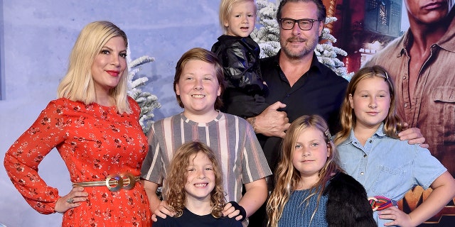 Tori Spelling and her family at premiere of "Jumanji"