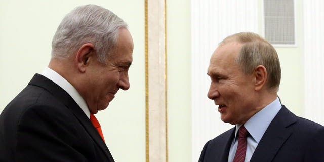 Russian President Vladimir Putin greets Israeli Prime Minister Benjamin Netanyahu during their meeting on Jan. 30, 2020, in Moscow.