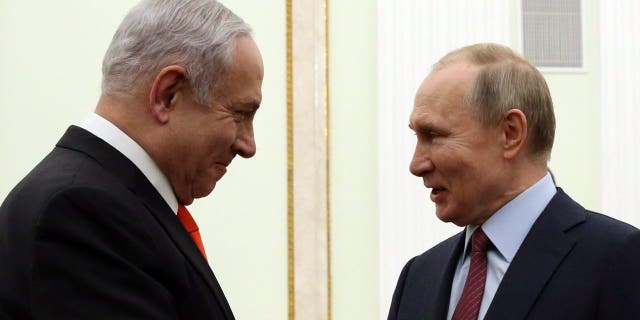 Russian President Vladimir Putin greets Israeli Prime Minister Benjamin Netanyahu during their meeting on Jan. 30, 2020, in Moscow.
