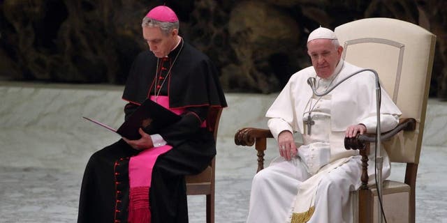 Pope Francis and the German archbishop Georg Gaenswein, prefect of the Papal Household, during the weekly general audience in the Paul VI Hall.