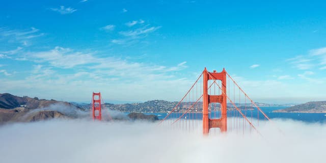 An aerial view of the Golden Gate Bridge is seen with fog in San Francisco, California, on October 29, 2021.