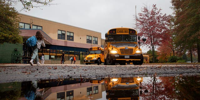 Students make their way to buses at King Middle School.