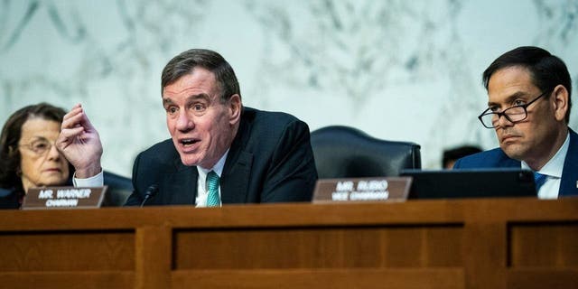 Chairman Mark Warner, D-Va., left, and Sen. Marco Rubio, R-Fla., speak during a Senate Intelligence Committee hearing on global threats as Russia continues to attack the Ukraine, on Capitol Hill Thursday, March 10, 2022 in Washington DC. 