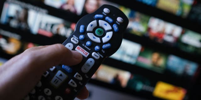 In this illustration photo taken on July 19, 2022, the Netflix logo is seen on a TV remote in Los Angeles.