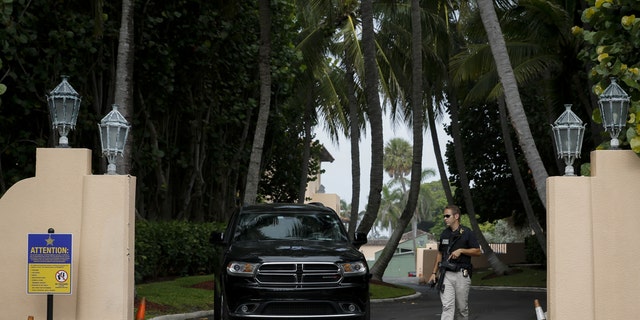 A member of US Secret Service at the entrance of former US President Donald Trump's house at Mar-A-Lago in Palm Beach, Florida, US, on Tuesday, Aug. 9, 2022.