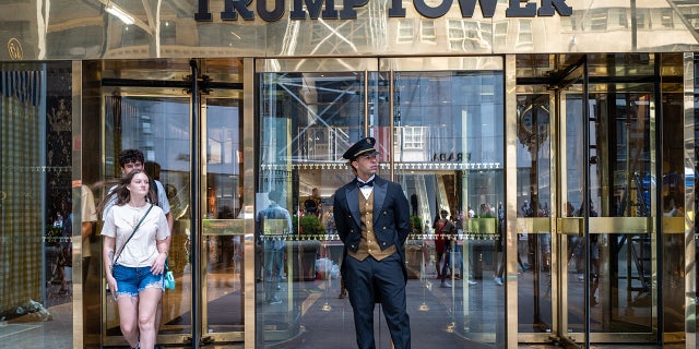 People walk out of Trump Tower in Manhattan Aug. 10, 2022, in New York City. According to a recent report, the FBI was looking for nuclear-related documents among others when it searched Mar-a-Lago.