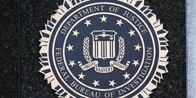 The seal of the Federal Bureau of Investigation is seen outside of its headquarters in Washington, DC on August 15, 2022. 