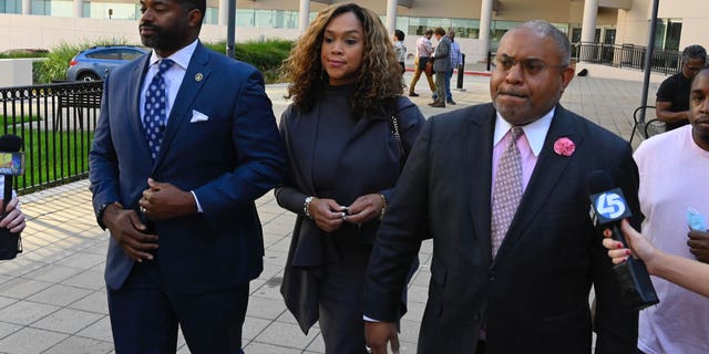 A. Scott Bolden, a former defense attorney for Marilyn Mosby, proclaims his client's innocence after leaving federal court with her and her husband, Nick Mosby, on Tuesday, Sept. 14, 2022, in Baltimore.