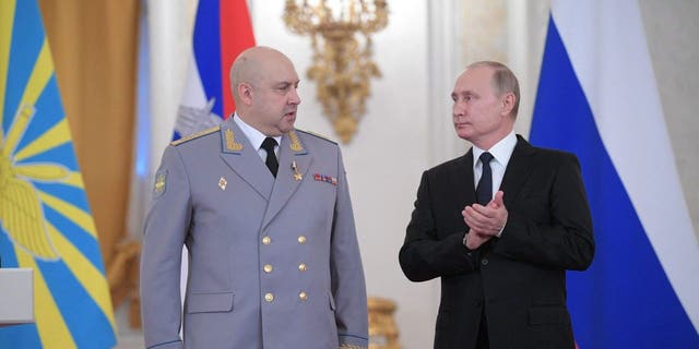 In this picture taken on Dec. 28, 2017, Russian President Vladimir Putin presents an award to Colonel General Sergei Surovikin, the commander of Russian troops in Syria, during a ceremony to bestow state awards on military personnel who fought in Syria, at the Kremlin in Moscow. 