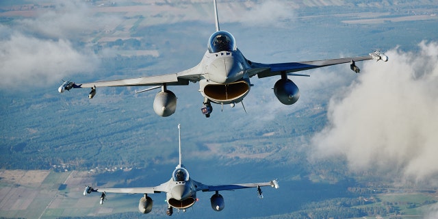 F-16 fighter jets take part in a NATO air protection exercise near the air base in Lass, central Poland on October 12, 2022. 