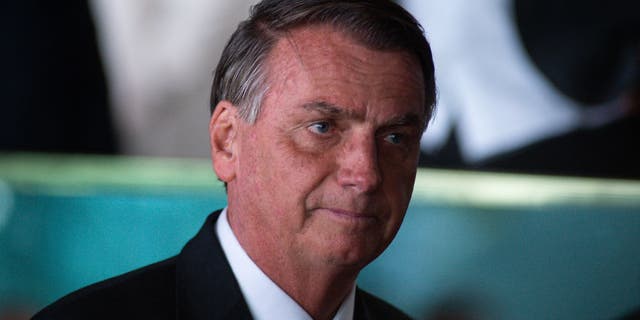 Former Brazilian President Jair Bolsonaro looks on after a press conference two days after losing to newly-elected President Lula da Silva in the presidential runoff at Alvorada Palace on Nov. 1, 2022, in Brasilia, Brazil. 