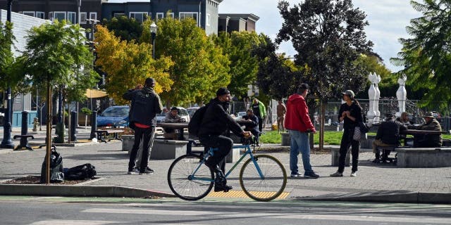 Pedestrians travel along Hayes Street in the Hayes Valley neighborhood of San Francisco, California, on November 2, 2022.
