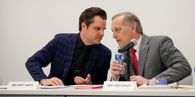 (L-R) Rep. Matt Gaetz, R-Fla., talks with Rep. Andy Biggs, R-Ariz., on November 14, 2022 in Washington, DC. 