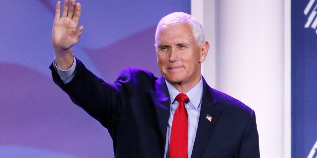 Former Vice President Mike Pence waves during the Republican Jewish Coalition Annual Leadership Meeting in Las Vegas, Nevada, on Nov. 18, 2022.