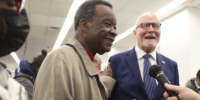 Mayoral candidates Willie Wilson, left, and Paul Vallas talk before filing petition signatures on Nov. 21, 2022, at the Chicago Board of Elections Loop Super Site. 