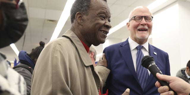 Mayoral candidates Willie Wilson, left, and Paul Vallas talk before filing petition signatures on Nov. 21, 2022, at the Chicago Board of Elections Loop Super Site.