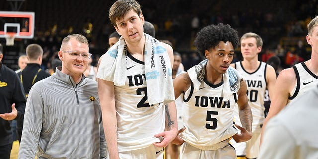 Iowa forward Patrick McCaffery, #22, and Iowa guard Dasonta Bowen, #5, leave the after winning a college basketball game between the Nebraska Omaha Mavericks and the Iowa Hawkeyes on Nov. 21, 2022, at Carver-Hawkeye Arena in Iowa City, Iowa.