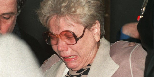 December 21, 1988 photograph of a mourning woman at New York's John F. Kennedy Airport after learning of the explosion of a Pan Am Boeing 747 over Lockerbie that killed all 259 passengers, including her son. 