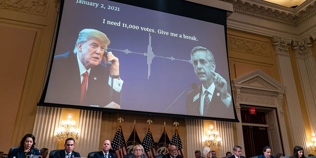 A digital presentation of President Donald Trump speaking with Georgia Secretary of State Brad Raffensperger is displayed on a screen as the House Select Committee to Investigate the January 6th Attack on the United States Capitol conducts its final hearing in the Cannon House Office Building on Monday, Dec 19, 2022 in Washington, DC. 