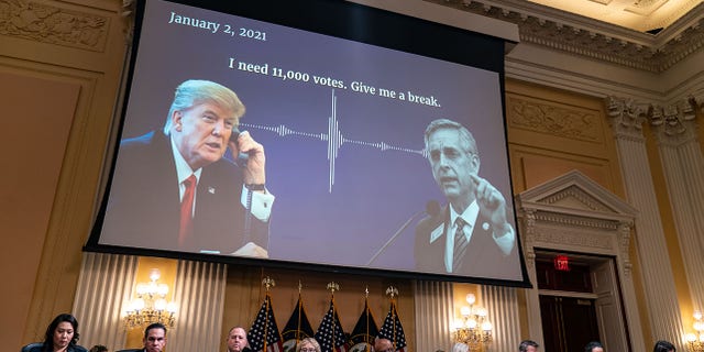 A digital presentation of President Donald Trump speaking with Georgia Secretary of State Brad Raffensperger is displayed on a screen as the House Select Committee to Investigate the January 6th Attack on the United States Capitol conducts its final hearing in the Cannon House Office Building on Monday, Dec 19, 2022 in Washington, DC. 