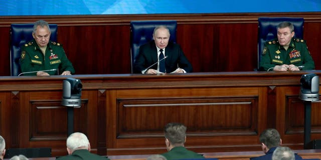 President Vladimir Putin and Gen. Valery Gerasimov, right, attend an expanded meeting of the Russian Defense Ministry Board in Moscow, on Dec. 21, 2022.