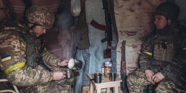 BAKHMUT, UKRAINE - DECEMBER 31: Ukrainian soldiers are seen in a trench on New Year's Eve in Bakhmut, Ukraine on December 31, 2022.