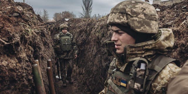 BAKHMUT, UKRAINE - DECEMBER 31: Ukrainian soldiers are seen in a trench on New Year's Eve in Bakhmut, Ukraine on December 31, 2022. 