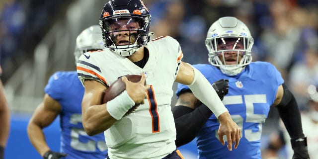 Chicago Bears quarterback Justin Fields, #1, carries the ball under pressure from the Detroit Lions defense during an NFL football game between the Detroit Lions and Minnesota Vikings in Detroit Sunday, May 1 January 2023. 