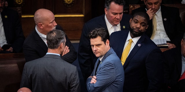 Rep. Chip Roy (R-TX), Rep. Scott Perry (R-PA), Rep. Matt Gaetz (R-FL) and Rep. Byron Donalds (R-FL) confer with each other on the floor of the House Chamber of the U.S. Capitol Building on Wednesday, Jan. 4, 2023 in Washington, D.C.
