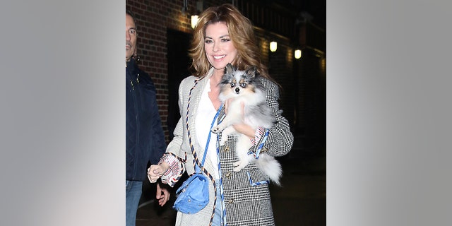Ahead of her "Today" interview, Shania Twain was spotted in New York with her fluffy dog.