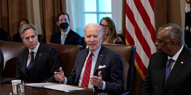 President Biden is flanked by Secretary of State Antony Blinken and Secretary of Defense Lloyd Austin during a cabinet meeting on Jan. 5.