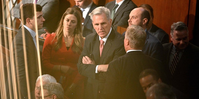 US Representative Kevin McCarthy (R-CA) (C) reacts during a conversation as voting continues for new speaker at the US Capitol in Washington, DC, on January 5, 2023. - The US House of Representatives plunged deeper into crisis Thursday as Republican favorite Kevin McCarthy failed again to win the speakership -- entrenching a three-day standoff that has paralyzed the lower chamber of Congress. 