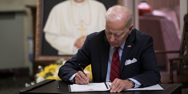 President Biden signs the condolence book for Pope Emeritus Benedict XVI at the Apostolic Nunciature of the Holy See in Washington, D.C., Thursday, Jan. 5, 2023.