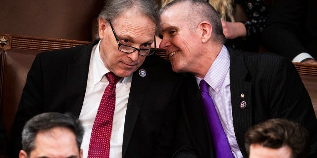 Reps.-elect Andy Biggs, R-Ariz., left, and Matt Rosendale, R-Mont., are seen on the House floor during a vote in which House Republican Leader Kevin McCarthy, R-Calif., did not receive enough votes to become speaker of the House on Thursday.