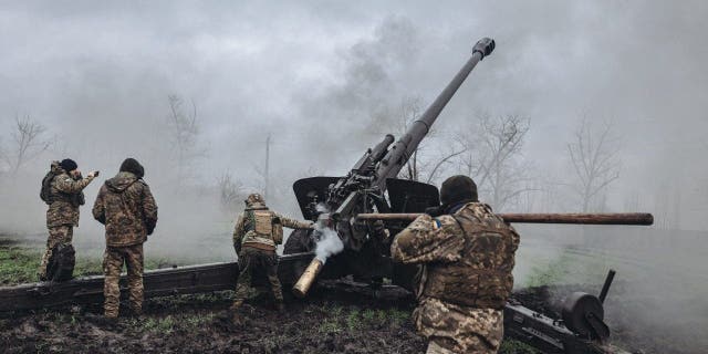 Ukrainian soldiers fire artillery on the Pisky frontline in Donetsk oblast, Ukraine on Jan. 6, 2023. 