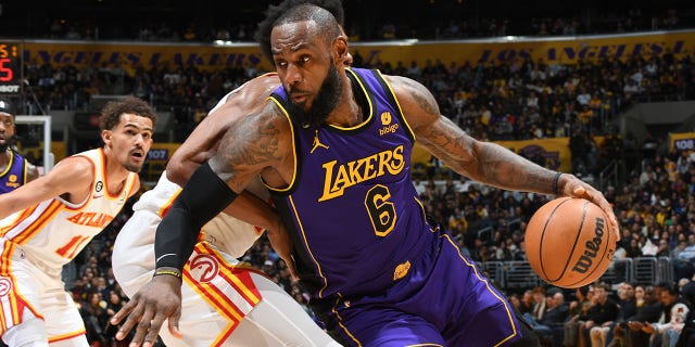 LeBron James #6 of the Los Angeles Lakers handles the ball during the game against the Atlanta Hawks on January 6, 2023, at Crypto.Com Arena in Los Angeles, California.