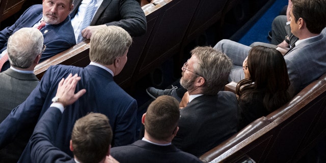 Representative Richard Hudson, a Republican from North Carolina, bottom left, pulls Representative Mike Rogers, a Republican from Alabama, left, as he approaches Representative Matt Gaetz, a Republican from Florida.