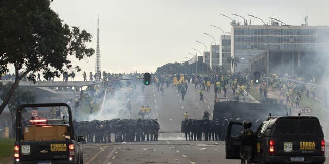 Supporters of former President Jair Bolsonaro clash with security forces as they raid the National Congress in Brasilia, Brazil, 08 January 2023. ( Joedson Alves/Anadolu Agency via Getty Images)