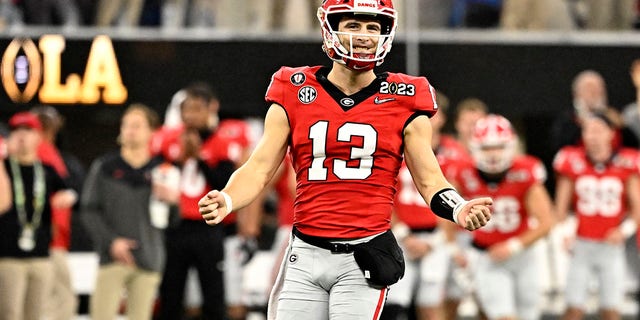 Georgia Bulldogs quarterback Stetson Bennett #13 reacts after a touchdown against the TCU Horned Frogs in the first half of the CFP National Championship football game at SoFi Stadium in Inglewood on Monday, January 9, 2023. 